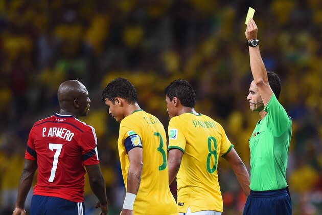 FORTALEZA, BRAZIL - JULY 04: Referee Carlos Velasco Carballo shows Thiago Silva of Brazil a yellow card during the 2014 FIFA World Cup Brazil Quarter Final match between Brazil and Colombia at Castelao on July 4, 2014 in Fortaleza, Brazil. (Photo by Buda Mendes/Getty Images) FORTALEZA, BRAZIL - JULY 04: Referee Carlos Velasco Carballo shows Thiago Silva of Brazil a yellow card during the 2014 FIFA World Cup Brazil Quarter Final match between Brazil and Colombia at Castelao on July 4, 2014 in Fortaleza, Brazil. (Photo by Buda Mendes/Getty Images)