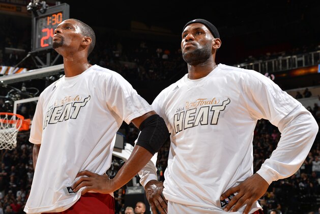 SAN ANTONIO, TX - JUNE 5: LeBron James #6 and Chris Bosh #1 of the Miami Heat looks on against the San Antonio Spurs during Game One of the 2014 NBA Finals on June 5, 2014 at AT&T Center in San Antonio, Texas. NOTE TO USER: User expressly acknowledges and agrees that, by downloading and or using this photograph, User is consenting to the terms and conditions of the Getty Images License Agreement. Mandatory Copyright Notice: Copyright 2014 NBAE (Photo by Jesse D. Garrabrant/NBAE via Getty Images)