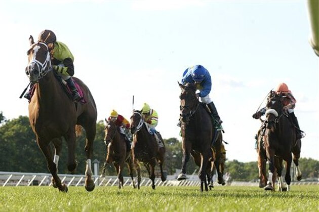 In this image released by EQUI-PHOTO, Dancing Solo, left, with Joe Bravo up, heads to the finish line to win the $100,000 Boiling Springs Stakes horse race at Monmouth Park on Saturday, June 23, 2012, in Oceanport, N.J. (AP Photo/EQUI-PHOTO, Bill Denver)