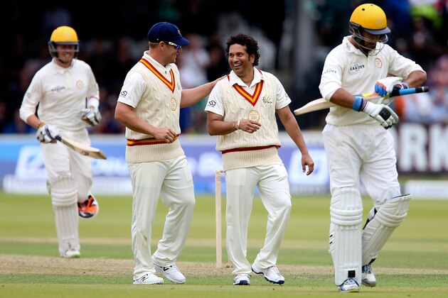 LONDON, ENGLAND - JULY 05: Sachin Tendulkar of MCC celebrates with team mate Arron Finch after dismissing Yuvraj Singh of Rest of the World (R) during the MCC and Rest of the World match at Lord's Cricket Ground on July 5, 2014 in London, England.  (Photo by Ben Hoskins/Getty Images)