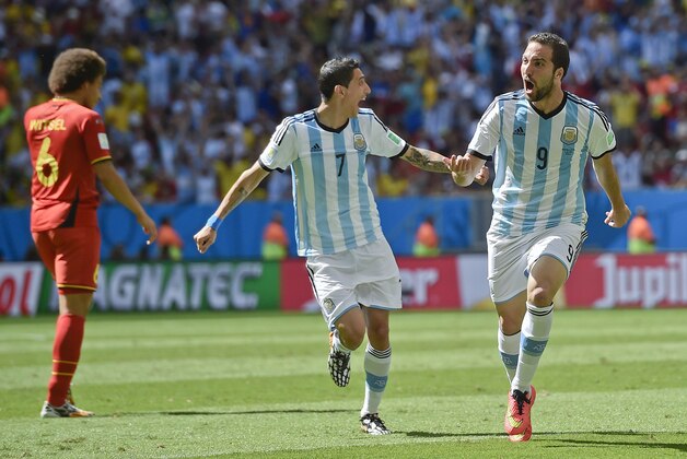Argentina's Gonzalo Higuain, right, celebrates with Angel di Maria after scoring the opening goal during the World Cup quarterfinal soccer match between Argentina and Belgium at the Estadio Nacional in Brasilia, Brazil, Saturday, July 5, 2014. (AP Photo/Martin Meissner)