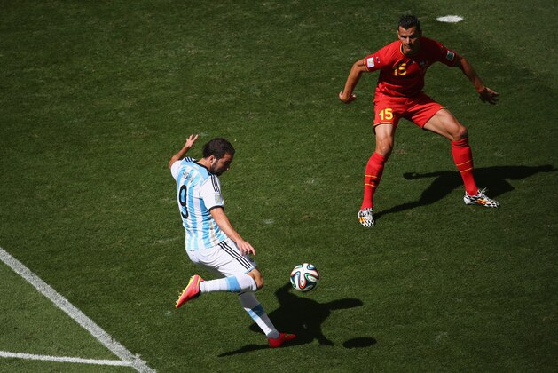 BRASILIA, BRAZIL - JULY 05:  Gonzalo Higuain of Argentina scores his team's first goal against Daniel Van Buyten of Belgium during the 2014 FIFA World Cup Brazil Quarter Final match between Argentina and Belgium at Estadio Nacional on July 5, 2014 in Brasilia, Brazil.  (Photo by Jamie Squire/Getty Images)