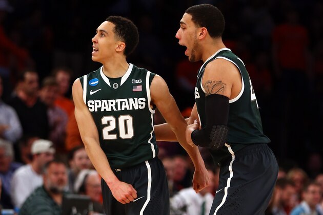NEW YORK, NY - MARCH 28:  Travis Trice #20 and Denzel Valentine #45 of the Michigan State Spartans celebrate after a basket in the second half against the Virginia Cavaliers during the regional semifinal of the 2014 NCAA Men's Basketball Tournament at Madison Square Garden on March 28, 2014 in New York City.  (Photo by Elsa/Getty Images)