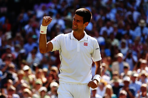 LONDON, ENGLAND - JULY 04:  Novak Djokovic of Serbia celebrates after winning his Gentlemen's Singles semi-final match against Grigor Dimitrov of Bulgaria on day eleven of the Wimbledon Lawn Tennis Championships at the All England Lawn Tennis and Croquet Club on July 4, 2014 in London, England.  (Photo by Clive Brunskill/Getty Images)
