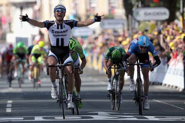 HARROGATE, ENGLAND - JULY 05:  Marcel Kittel of Germany and Team Giant-Shimano celebrates his victory ahead of Peter Sagan of Slovakia and Cannondale in second place, Ramunas Navardauskas of Lithuania and Garmin-Sharp in third place and Bryan Coquard of France and Team Europcar in fourth place in stage one of the 2014 Tour de France from Leeds to Harrogate on July 5, 2014 in Harrogate, United Kingdom.  (Photo by Doug Pensinger/Getty Images)