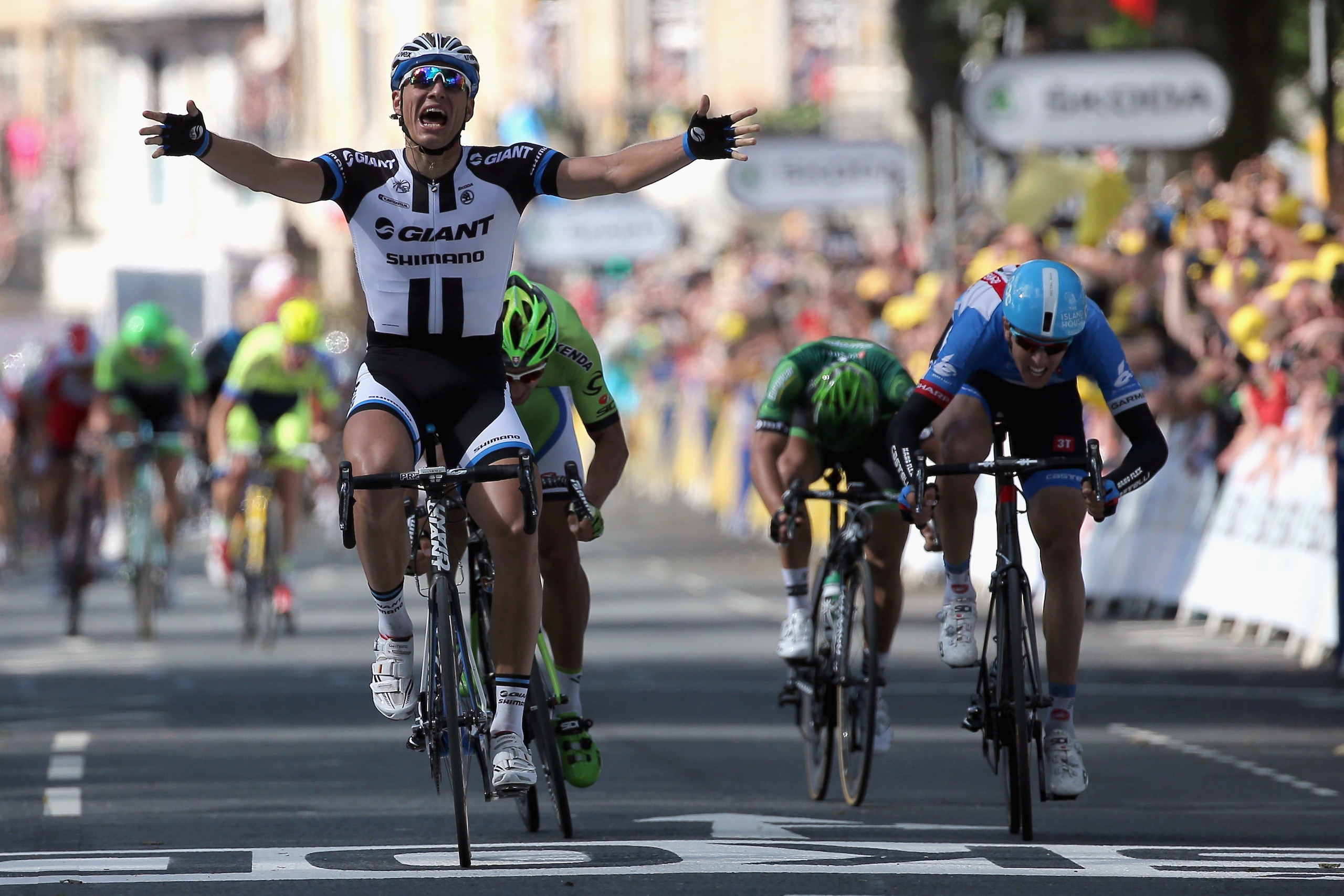 HARROGATE, ENGLAND - JULY 05:  Marcel Kittel of Germany and Team Giant-Shimano celebrates his victory ahead of Peter Sagan of Slovakia and Cannondale in second place, Ramunas Navardauskas of Lithuania and Garmin-Sharp in third place and Bryan Coquard of France and Team Europcar in fourth place in stage one of the 2014 Tour de France from Leeds to Harrogate on July 5, 2014 in Harrogate, United Kingdom.  (Photo by Doug Pensinger/Getty Images)