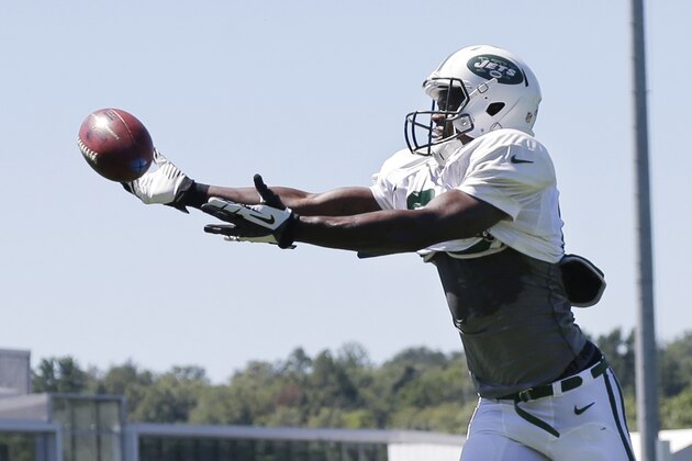 New York Jets wide receiver Stephen Hill reaches for a pass during NFL football practice in Florham Park, N.J., Wednesday, Sept. 4, 2013. (AP Photo/Mel Evans)