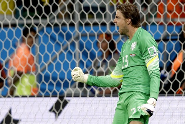 Netherlands' goalkeeper Tim Krul celebrates after saving a penalty during penalty kicks of  the World Cup quarterfinal soccer match between the Netherlands and Costa Rica at the Arena Fonte Nova in Salvador, Brazil, Saturday, July 5, 2014. (AP Photo/Hassan Ammar)