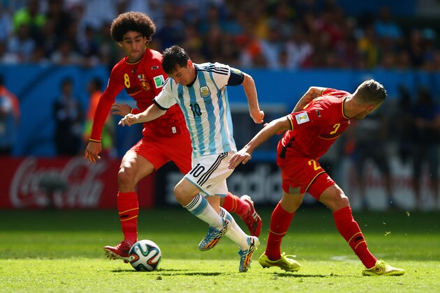 BRASILIA, BRAZIL - JULY 05: Lionel Messi of Argentina controls the ball against Marouane Fellaini (L) and Toby Alderweireld of Belgium during the 2014 FIFA World Cup Brazil Quarter Final match between Argentina and Belgium at Estadio Nacional on July 5, 2014 in Brasilia, Brazil. (Photo by Clive Rose/Getty Images) BRASILIA, BRAZIL - JULY 05: Lionel Messi of Argentina controls the ball against Marouane Fellaini (L) and Toby Alderweireld of Belgium during the 2014 FIFA World Cup Brazil Quarter Final match between Argentina and Belgium at Estadio Nacional on July 5, 2014 in Brasilia, Brazil. (Photo by Clive Rose/Getty Images)