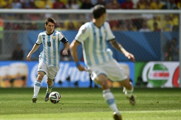 Argentina's Lionel Messi, left, runs with the ball during the World Cup quarterfinal soccer match between Argentina and Belgium at the Estadio Nacional in Brasilia, Brazil, Saturday, July 5, 2014. (AP Photo/Martin Meissner) Argentina's Lionel Messi, left, runs with the ball during the World Cup quarterfinal soccer match between Argentina and Belgium at the Estadio Nacional in Brasilia, Brazil, Saturday, July 5, 2014. (AP Photo/Martin Meissner)