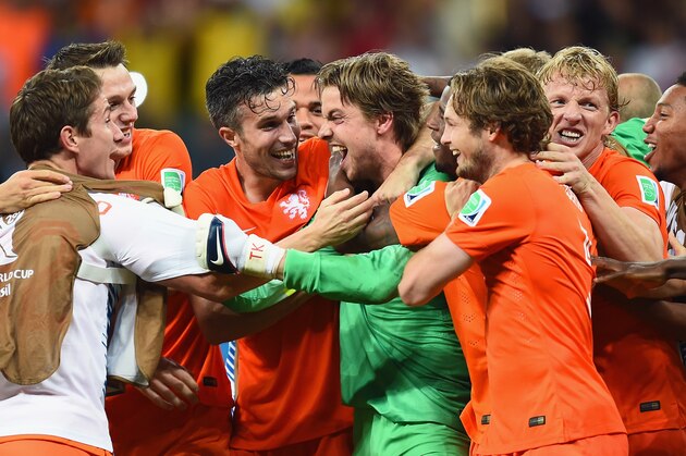 SALVADOR, BRAZIL - JULY 05:  Goalkeeper Tim Krul of the Netherlands celebrates with teammates after making a save in a penalty shootout to defeat Costa Rica during the 2014 FIFA World Cup Brazil Quarter Final match between the Netherlands and Costa Rica at Arena Fonte Nova on July 5, 2014 in Salvador, Brazil.  (Photo by Jamie McDonald/Getty Images)