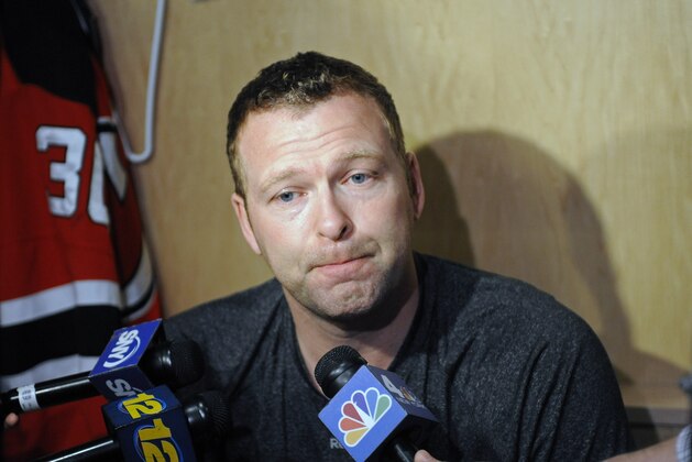 New Jersey Devils goaltender Martin Brodeur talks to the media as the NHL hockey team clean out their lockers Monday, April 14, 2014, in Newark, N.J. (AP Photo/Bill Kostroun)