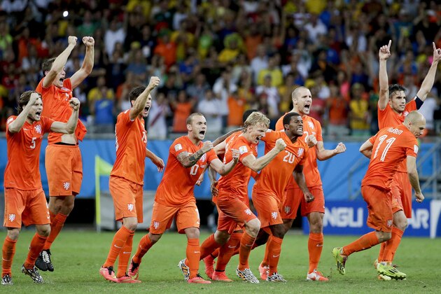 The Dutch team reacts during a penalty shoot out during the World Cup quarterfinal soccer match between the Netherlands and Costa Rica at the Arena Fonte Nova in Salvador, Brazil, Saturday, July 5, 2014. The Netherlands won 4-3 0n penalties after the match ended 0-0 after extra time.  (AP Photo/Felipe Dana)