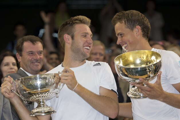 Jul 5, 2014; London, United Kingdom; Jack Sock (USA) and Vasek Pospisil (CAN) with their trophies after recording match point in their match against Bob and Mike Bryan (USA) on day 12 of the 2014 Wimbledon Championships at the All England Lawn and Tennis Club. Mandatory Credit: Susan Mullane-USA TODAY Sports