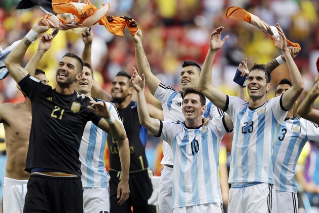 Argentina's Lionel Messi (10) and his teammates celebrate following their 1-0 victory over Belgium to advance to the semifinals after the World Cup quarterfinal soccer match at the Estadio Nacional in Brasilia, Brazil, Saturday, July 5, 2014. (AP Photo/Kirsty Wigglesworth)