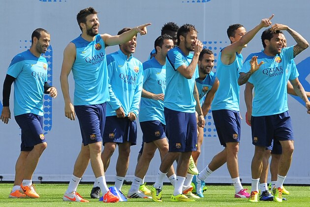 FC Barcelona's players react,  during a training session,  in San Joan Despi, Spain, Friday, May 16, 2014. Barcelona faces Spanish leader Atletico Madrid in a winner-takes-all league finale on Saturday, when the defending champion could yet lift its fifth title in six seasons. (AP Photo/Manu Fernandez)