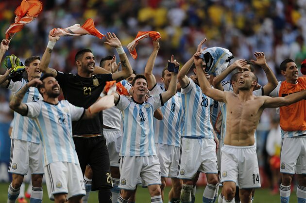 Argentina's Lionel Messi and teammates celebrate at the end of the World Cup quarterfinal soccer match between Argentina and Belgium at the Estadio Nacional in Brasilia, Brazil, Saturday, July 5, 2014. Argentina won 1-0. (AP Photo/Eraldo Peres) Argentina's Lionel Messi and teammates celebrate at the end of the World Cup quarterfinal soccer match between Argentina and Belgium at the Estadio Nacional in Brasilia, Brazil, Saturday, July 5, 2014. Argentina won 1-0. (AP Photo/Eraldo Peres)