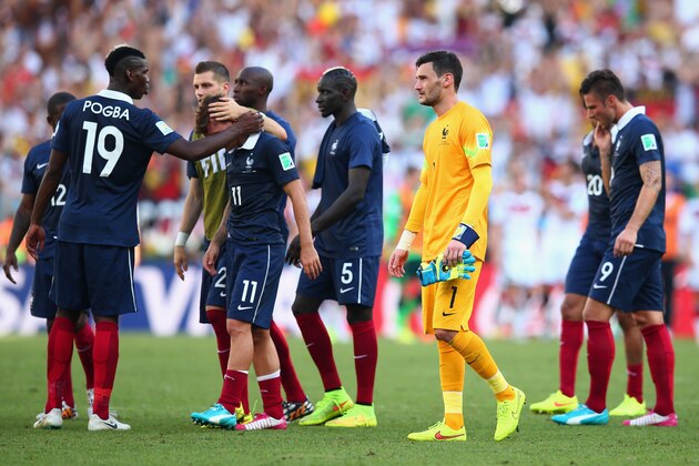 RIO DE JANEIRO, BRAZIL - JULY 04: Paul Pogba (L) consoles Antoine Griezmann of France as goalkeeper Hugo Lloris looks on during the 2014 FIFA World Cup Brazil Quarter Final match between France and Germany at Maracana on July 4, 2014 in Rio de Janeiro, Brazil.  (Photo by Julian Finney/Getty Images)