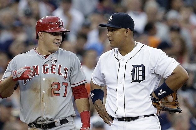 Los Angeles Angels' Mike Trout (27) talks to Detroit Tigers third baseman Miguel Cabrera after advancing to third base on an Albert Pujols fly out in the third inning of a baseball game in Detroit, Tuesday, June 25, 2013. (AP Photo/Paul Sancya)