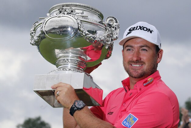 Graeme McDowell of Northern Ireland poses with his trophy after winning the French Open Golf tournament at Paris National course in Guyancourt, west of Paris, France, Sunday, July 6, 2014. (AP Photo/Francois Mori)