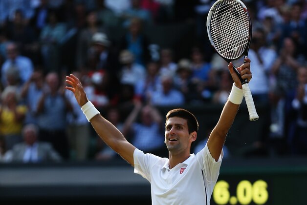 LONDON, ENGLAND - JULY 06:  Novak Djokovic of Serbia celebrates championship point and winning the Gentlemen's Singles Final match against Roger Federer of Switzerland on day thirteen of the Wimbledon Lawn Tennis Championships at the All England Lawn Tennis and Croquet Club on July 6, 2014 in London, England.  (Photo by Matthew Stockman/Getty Images)