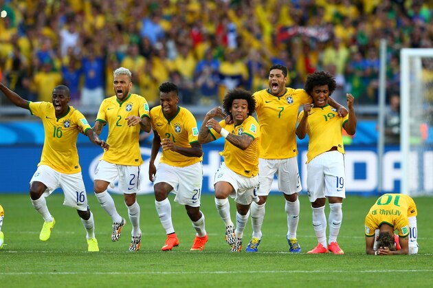BELO HORIZONTE, BRAZIL - JUNE 28: (L-R) Thiago Silva, Luiz Gustavo, Ramires, Dani Alves, Jo, Marcelo, Hulk, Willian and Neymar of Brazil celebrate after defeating Chile in a penalty shootout during the 2014 FIFA World Cup Brazil round of 16 match between Brazil and Chile at Estadio Mineirao on June 28, 2014 in Belo Horizonte, Brazil.  (Photo by Quinn Rooney/Getty Images)