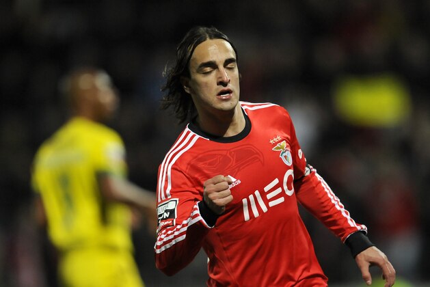 Benfica's Lazar Markovic, from Serbia, reacts as he celebrates after scoring his side's second goal against Pacos Ferreira in a Portuguese League soccer match at Mata Real stadium in Pacos de Ferreira, northern Portugal, Sunday, Feb. 16, 2014. (AP Photo/Paulo Duarte)