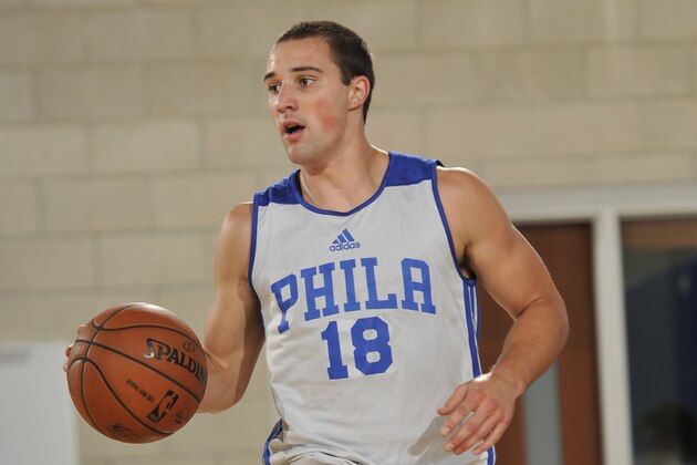 ORLANDO, FL - JULY 5: Aaron Craft #18 of the Philadelphia 76ers drives against the Orlando Magic on July 5, 2014 at Amway Center in Orlando, Florida. NOTE TO USER: User expressly acknowledges and agrees that, by downloading and or using this photograph, User is consenting to the terms and conditions of the Getty Images License Agreement. Mandatory Copyright Notice: Copyright 2014 NBAE  (Photo by Fernando Medina/NBAE via Getty Images)