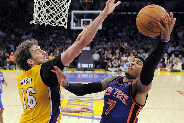 New York Knicks forward Carmelo Anthony, right, puts up a shot as Los Angeles Lakers forward Pau Gasol of Spain defends during the second half of their NBA basketball game, Thursday, Dec. 29, 2011, in Los Angeles. The Lakers won 99-82.  (AP Photo/Mark J. Terrill)
