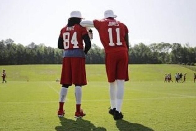 Atlanta Falcons wide receivers Roddy White, left, and Julio Jones watch from the sidelines during NFL football minicamp Thursday, June 19, 2014, in Flowery Branch, Ga. (AP Photo/David Goldman)
