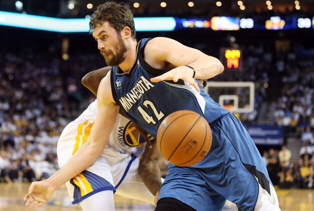 Apr 14, 2014; Oakland, CA, USA; Minnesota Timberwolves forward Kevin Love (42) loses the ball against Golden State Warriors forward Draymond Green (23) during the first quarter at Oracle Arena. Mandatory Credit: Kelley L Cox-USA TODAY Sports