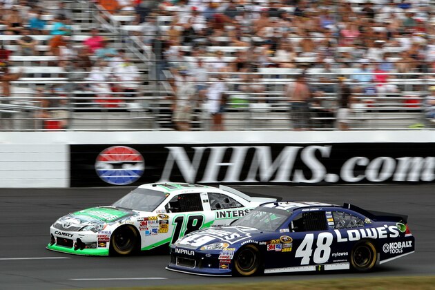 LOUDON, NH - JULY 15:  Kyle Busch, driver of the #18 Interstate Batteries Toyota, and Jimmie Johnson, driver of the #48 Lowe's Chevrolet, race during the NASCAR Sprint Cup Series LENOX Industrial Tools 301 at New Hampshire Motor Speedway on July 15, 2012 in Loudon, New Hampshire.  (Photo by Jerry Markland/Getty Images for NASCAR)