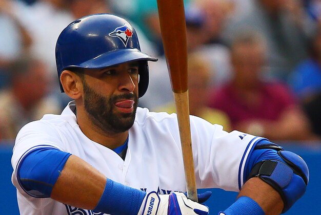 TORONTO, ON - JUNE 10: Jose Bautista #19 of the Toronto Blue Jays stretches before his at bat in the first inning against the Minnesota Twins during MLB  action at the Rogers Centre June 10, 2014 in Toronto, Ontario, Canada.  (Photo by Abelimages/Getty Images)