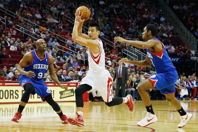 HOUSTON, TX - MARCH 27:  Jeremy Lin #7 of the Houston Rockets drives with the ball against James Anderson #9 and Hollis Thompson #31 of the Philadelphia 76ers at the Toyota Center on March 27, 2014 in Houston, Texas. NOTE TO USER: User expressly acknowledges and agrees that, by downloading and or using this photograph, User is consenting to the terms and conditions of the Getty Images License Agreement. (Photo by Scott Halleran/Getty Images)