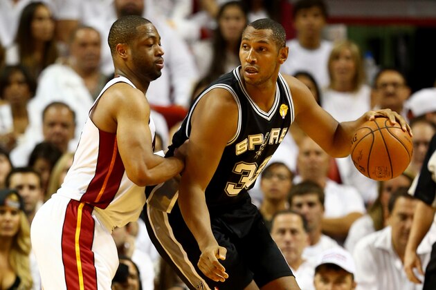 MIAMI, FL - JUNE 12: Boris Diaw #33 of the San Antonio Spurs looks to pass as Dwyane Wade #3 of the Miami Heat defends during Game Four of the 2014 NBA Finals at American Airlines Arena on June 12, 2014 in Miami, Florida. NOTE TO USER: User expressly acknowledges and agrees that, by downloading and or using this photograph, User is consenting to the terms and conditions of the Getty Images License Agreement.  (Photo by Andy Lyons/Getty Images)