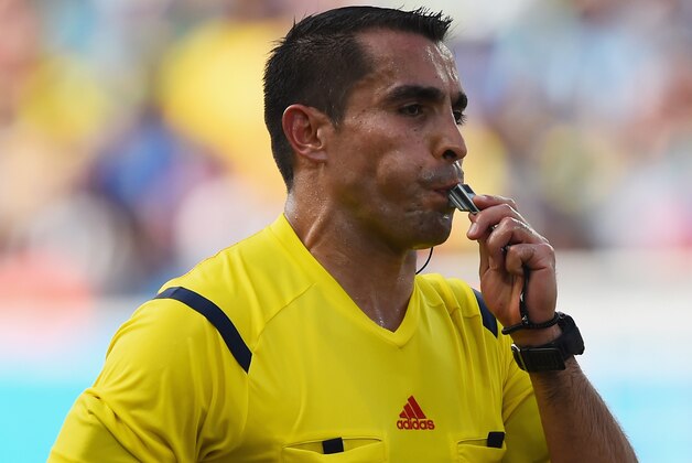 NATAL, BRAZIL - JUNE 24:  Referee Marco Rodriguez blows the whistle during the 2014 FIFA World Cup Brazil Group D match between Italy and Uruguay at Estadio das Dunas on June 24, 2014 in Natal, Brazil.  (Photo by Matthias Hangst/Getty Images)