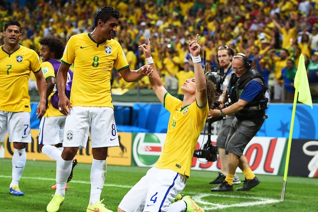FORTALEZA, BRAZIL - JULY 04:  David Luiz of Brazil (R) celebrates scoring his team's second goal on a free kick with Paulinho during the 2014 FIFA World Cup Brazil Quarter Final match between Brazil and Colombia at Castelao on July 4, 2014 in Fortaleza, Brazil.  (Photo by Laurence Griffiths/Getty Images)