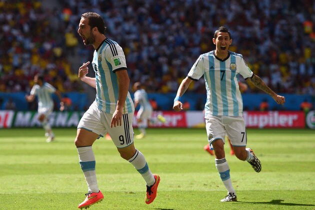 BRASILIA, BRAZIL - JULY 05: Gonzalo Higuain of Argentina (L) celebrates scoring his team's first goal with Angel di Maria during the 2014 FIFA World Cup Brazil Quarter Final match between Argentina and Belgium at Estadio Nacional on July 5, 2014 in Brasilia, Brazil.  (Photo by Matthias Hangst/Getty Images)