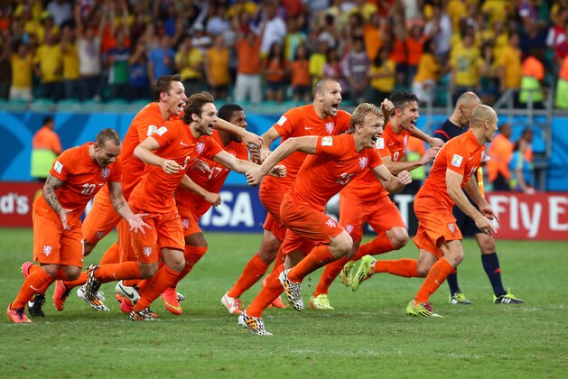 SALVADOR, BRAZIL - JULY 05: (L-R) Wesley Sneijder, Stefan de Vrij, Daley Blind, Jeremain Lens, Ron Vlaar, Dirk Kuyt, Robin van Persie and Arjen Robben of the Netherlands celebrate after defeating Costa Rica in a penalty shootout during the 2014 FIFA World Cup Brazil Quarter Final match between the Netherlands and Costa Rica at Arena Fonte Nova on July 5, 2014 in Salvador, Brazil.  (Photo by Robert Cianflone/Getty Images)