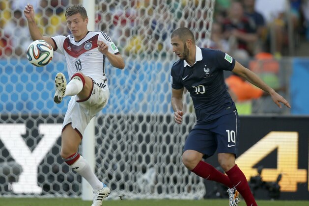 Germany's Toni Kroos controls the ball as France's Karim Benzema looks on during the World Cup quarterfinal soccer match between Germany and France at the Maracana Stadium in Rio de Janeiro, Brazil, Friday, July 4, 2014. (AP Photo/Frank Augstein) Germany's Toni Kroos controls the ball as France's Karim Benzema looks on during the World Cup quarterfinal soccer match between Germany and France at the Maracana Stadium in Rio de Janeiro, Brazil, Friday, July 4, 2014. (AP Photo/Frank Augstein)