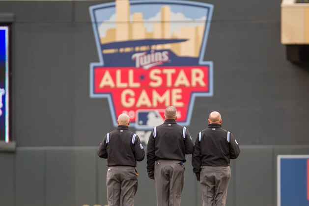Apr 13, 2014; Minneapolis, MN, USA; MLB umpires Mark Carlson, Scott Barry, and Jeff Nelson stand for God Bless America in front of the All Star Game 2014 logo at Target Field. Mandatory Credit: Brad Rempel-USA TODAY Sports Apr 13, 2014; Minneapolis, MN, USA; MLB umpires Mark Carlson, Scott Barry, and Jeff Nelson stand for God Bless America in front of the All Star Game 2014 logo at Target Field. Mandatory Credit: Brad Rempel-USA TODAY Sports