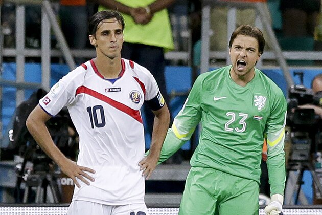 Netherlands' goalkeeper Tim Krul, right, celebrates after saving from Costa Rica's Bryan Ruiz in a penalty shoot out during the World Cup quarterfinal soccer match between the Netherlands and Costa Rica at the Arena Fonte Nova in Salvador, Brazil, Saturday, July 5, 2014. The Netherlands won 4-3 0n penalties after the match ended 0-0 after extra time. (AP Photo/Matt Dunham)