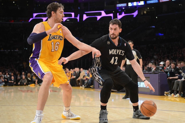 LOS ANGELES, CA - DECEMBER 20: Kevin Love #42 of the Minnesota Timberwolves drives against Pau Gasol #16 of the Los Angeles Lakers at Staples Center on December 20, 2013 in Los Angeles, California. NOTE TO USER: User expressly acknowledges and agrees that, by downloading and/or using this Photograph, user is consenting to the terms and conditions of the Getty Images License Agreement. Mandatory Copyright Notice: Copyright 2013 NBAE (Photo by Noah Graham/NBAE via Getty Images)