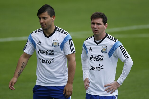 Argentina's Lionel Messi, right, walks next to teammate Sergio Aguero during a training session in Vespasiano, near Belo Horizonte, Brazil, Thursday, June 12, 2014. Argentina will play in group F of the Brazil 2014 soccer World Cup. (AP Photo/Victor R. Caivano) Argentina's Lionel Messi, right, walks next to teammate Sergio Aguero during a training session in Vespasiano, near Belo Horizonte, Brazil, Thursday, June 12, 2014. Argentina will play in group F of the Brazil 2014 soccer World Cup. (AP Photo/Victor R. Caivano)