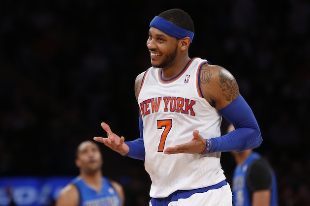 New York Knicks' Carmelo Anthony (7) reacts after hitting a 3-point shot against the Dallas Mavericks during the second half of an NBA basketball game Monday, Feb. 24, 2014, in New York.  Dallas won 110-108. (AP Photo/Jason DeCrow)