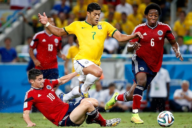 FORTALEZA, BRAZIL - JULY 04:  James Rodriguez of Colombia challenges Hulk of Brazil during the 2014 FIFA World Cup Brazil Quarter Final match between Brazil and Colombia at Castelao on July 4, 2014 in Fortaleza, Brazil.  (Photo by Gabriel Rossi/Getty Images)