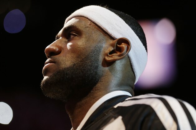 Miami Heat forward LeBron James during the pre-game ceremony in Game 4 of the NBA basketball finals against the San Antonio Spurs, Thursday, June 12, 2014, in Miami.  (AP Photo/Lynne Sladky)