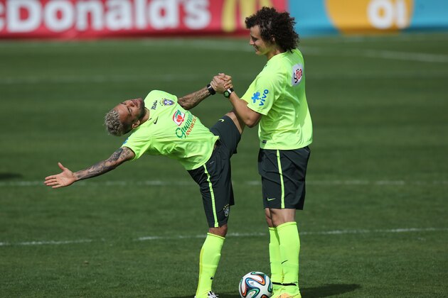 Brazil's Daniel Alves, left, stretches with David Luiz during a practice session at the Granja Comary training center, in Teresopolis, Brazil, Monday, July 7, 2014. Brazil will face Germany on Tuesday in a World Cup semifinal match without Neymar. (AP Photo/Leo Correa) Brazil's Daniel Alves, left, stretches with David Luiz during a practice session at the Granja Comary training center, in Teresopolis, Brazil, Monday, July 7, 2014. Brazil will face Germany on Tuesday in a World Cup semifinal match without Neymar. (AP Photo/Leo Correa)