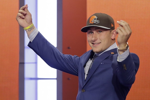 Texas A&M quarterback Johnny Manziel reacts after being selected by the Cleveland Browns as the 22nd pick in the first round of the 2014 NFL Draft, Thursday, May 8, 2014, in New York. (AP Photo/Frank Franklin II)