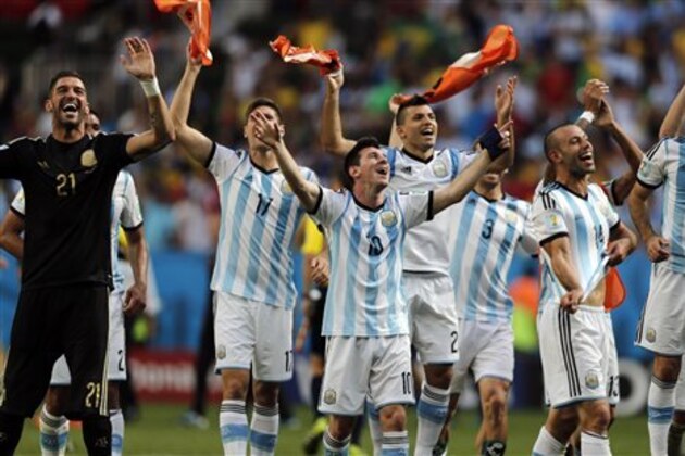 CORRECTS PHOTOGRAPHER'S BYLINE - Argentina's Lionel Messi and teammates celebrate at the end of the World Cup quarterfinal soccer match between Argentina and Belgium at the Estadio Nacional in Brasilia, Brazil, Saturday, July 5, 2014. Argentina won 1-0. (AP Photo/Eraldo Peres) CORRECTS PHOTOGRAPHER'S BYLINE - Argentina's Lionel Messi and teammates celebrate at the end of the World Cup quarterfinal soccer match between Argentina and Belgium at the Estadio Nacional in Brasilia, Brazil, Saturday, July 5, 2014. Argentina won 1-0. (AP Photo/Eraldo Peres)